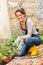 Woman gardening autumn flowers yard housework