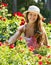 Woman gardening with roses