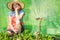 Woman with gardening tool working in greenhouse