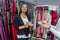 Woman in garment store with euro notes