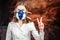 Woman in a gas mask Showing Peace Sign. Coronovirus Quarantine, Stay Home Concept. Covid-19 pandemic