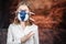 Woman in a gas mask Showing Peace Sign. Coronovirus Quarantine, Stay Home Concept. Covid-19 pandemic