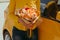 woman with gentle bouquet of yellow roses near yellow car