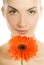 Woman with gerbera flower