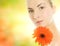 Woman with gerbera flower