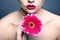 woman with gerbera pink lipstick