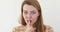 Woman Gesturing Silence Finger on Lips