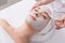 Woman gets face mask by beautician at spa