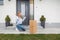 Woman gets overly excited when she sees the cardboard box waiting for her at the front door