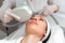 Woman Getting Facial Hydro Microdermabrasion Peeling Treatment At Cosmetic Beauty Spa Clinic. Hydra Vacuum Cleaner