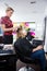 Woman Getting Hair Colored In Beauty Salon