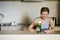 Woman getting having her green smoothie after training.