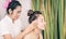 Woman getting head massaged in Thai massage spa