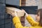 Woman getting parcel from cell of automatic post terminal outdoors