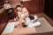 Woman getting special thai massage in massage salon.