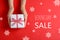 Woman with gift and text Boxing Day Sale on red background