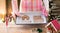 Woman with gingerbread house parts on oven tray