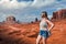 Woman girl hiker watching beautiful scenery in Monument valley, Utah, USA