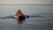 Woman and girl in life jackets rowing boat, touristic trip, entertainment