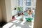 Woman and girl, mother and her daughter practicing yoga on a fitness mat at home on a beautiful sunny day. Enjoying togetherness