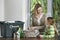 Woman And Girl Preparing Waste Paper For Recycling