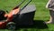 Woman girl skirt flip-flop shoes mow lawn grass cutter in yard