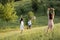 woman and girl waving hands to