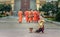 Woman give food offerings to Buddhist monks