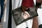 Woman with Givenchy bag with Rotweiler dog before Giamba fashion show, Milan Fashion Week street style on