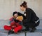 Woman gives bread a beggar child