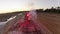 Woman gives a STOP signal for the train with red flare