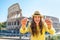 Woman giving headphones with audio guide in rome