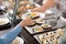 Woman giving plate with healthy food to boy in school canteen