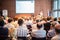 Woman giving presentation on business conference.