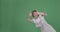 Woman giving thumbs up gesture and disappearing over green background