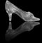 Woman glass shoe on black