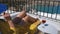 Woman with a glass of wine relaxes on a balcony