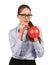 Woman with glasses inflating a rubber balloon