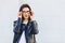 Woman in glasses in leather jacket on street