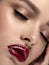 Woman with glittery red lips closeup portrait