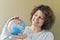 Woman with globe in hands thinking about traveling