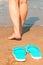Woman goes barefoot on the sand