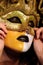 Woman in golden half mask