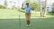 Woman golfer cheering as she sinks her putt