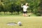 Woman golfer feeling disappointed after a putted golf ball missed
