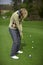 Woman golfer practicing putting