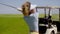 Woman golfer preparing to play a stroke