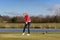 Woman golfer striking the golf ball