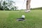 woman golfer teeing golf in golf tournament competition at golf course, selective focus on golf ball