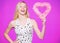 Woman gorgeous blonde girl hold heart valentines decoration. Happy valentines day. Valentines day attribute. Prepare